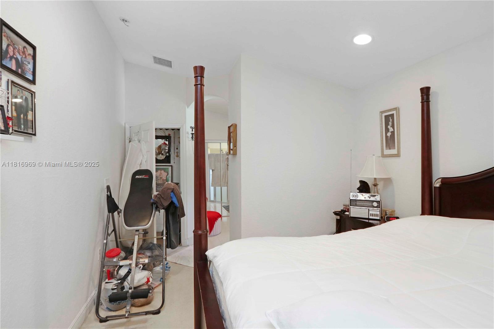 1585 Southeast 20th Road Homestead, FL 33035 - Photo 8 of 26 a bedroom with a bed and closet