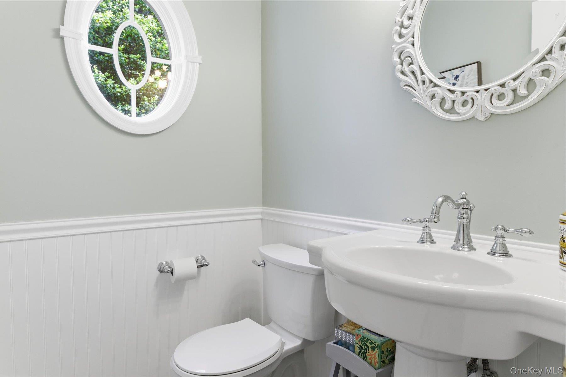 6 Brandy Road Cold Spring Harbor, NY 11724 - Photo 10 of 25 a bathroom with a toilet a sink and mirror