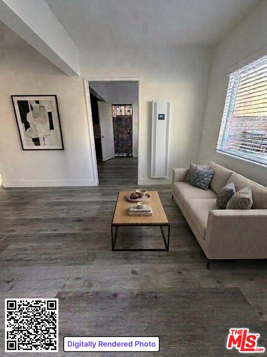 1850 West 145th Street, Unit A Gardena, CA 90249 - Photo 3 of 16 a living room with furniture and a table