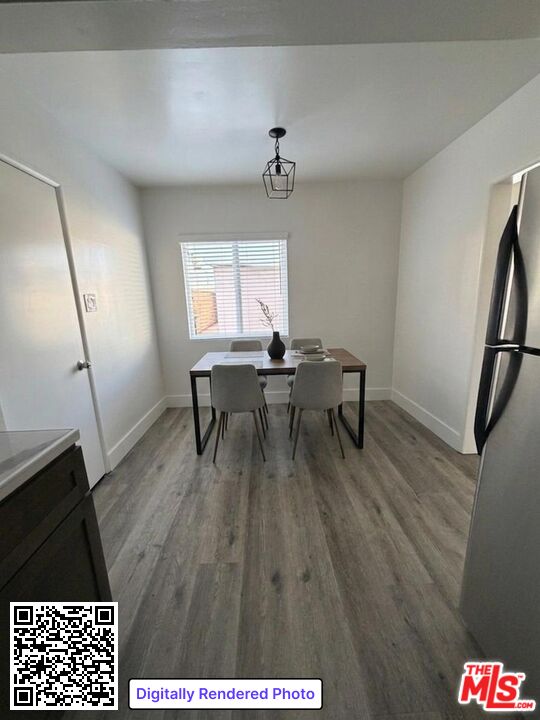 1850 West 145th Street, Unit A Gardena, CA 90249 - Photo 5 of 16 a view of a workspace with furniture and wooden floor