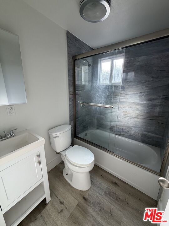 1850 West 145th Street, Unit A Gardena, CA 90249 - Photo 10 of 16 a bathroom with a granite countertop toilet a sink and a shower
