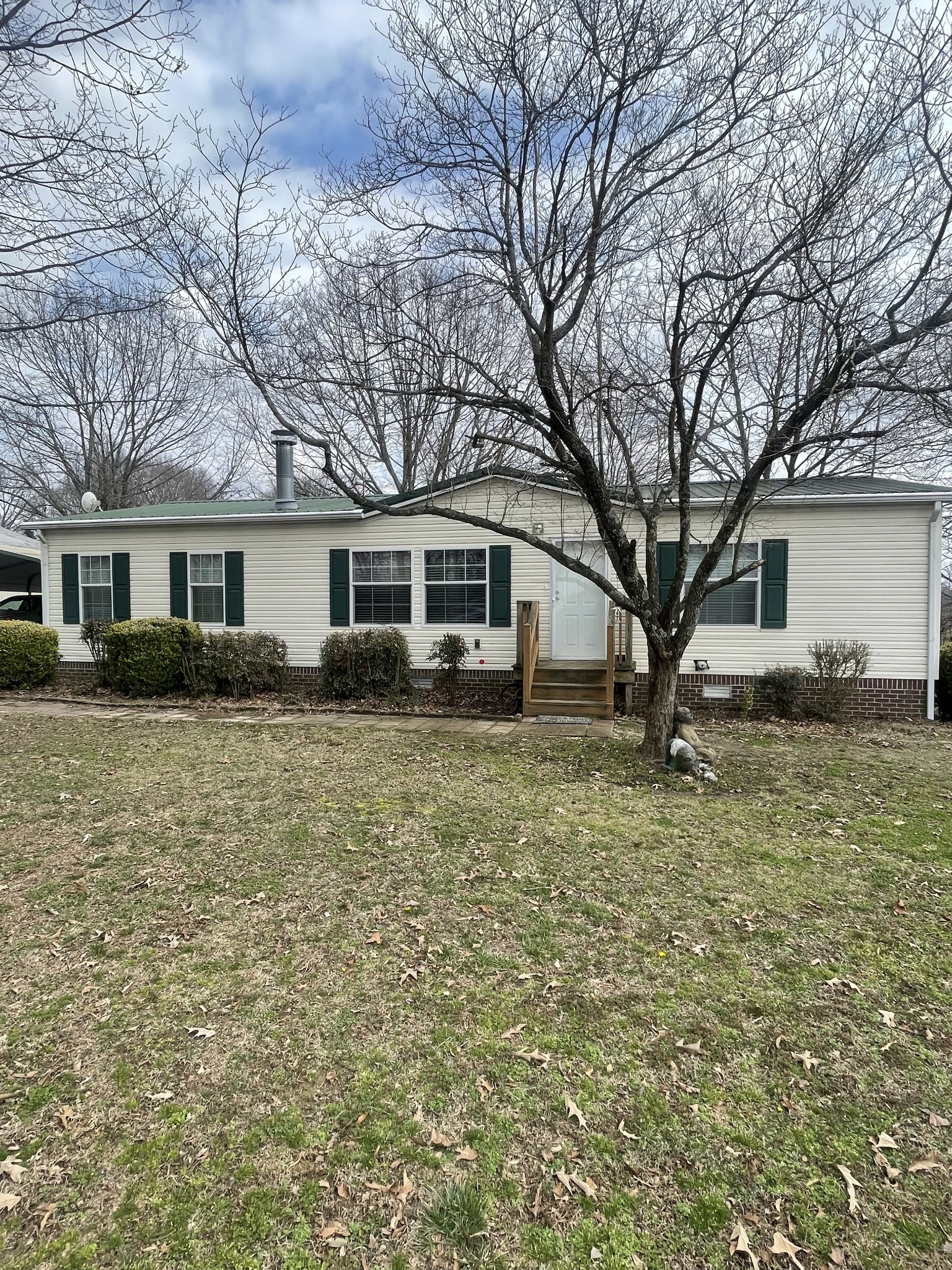 75 Snell Road Ethridge, TN 38456 - Photo 44 of 51 a front view of house with yard and trees around