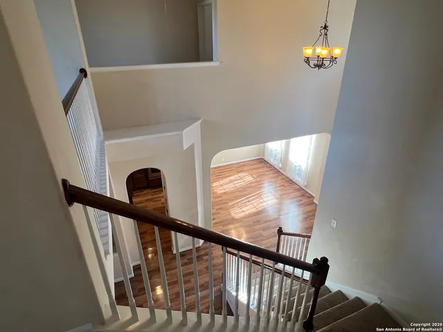 a view of an entryway with wooden floor