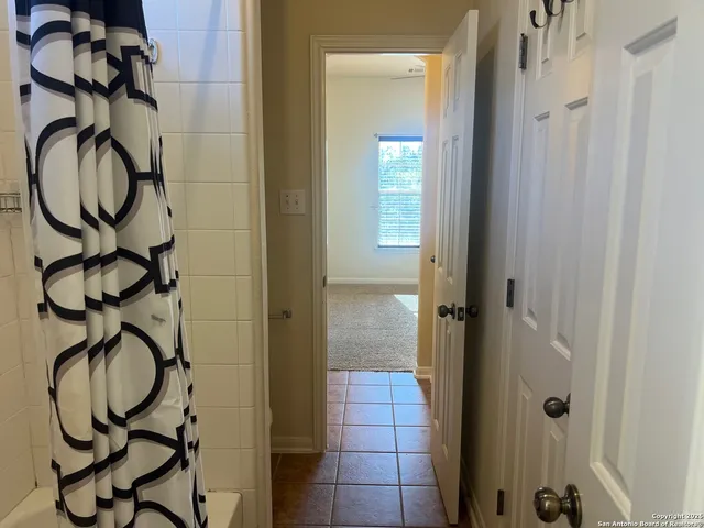 a bathroom with a mirror and a sink