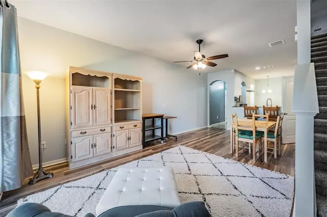 a very nice looking dining room with wooden floor