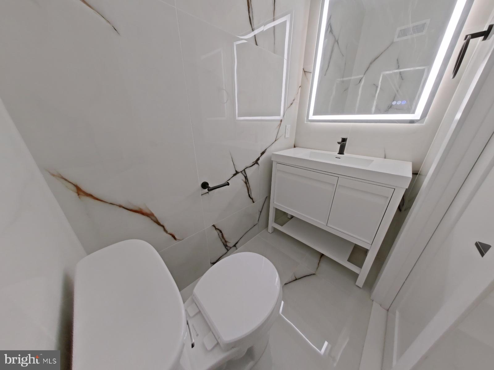 1307 North Randolph Street Philadelphia, PA 19122 - Photo 25 of 43 a bathroom with a sink a toilet and tub