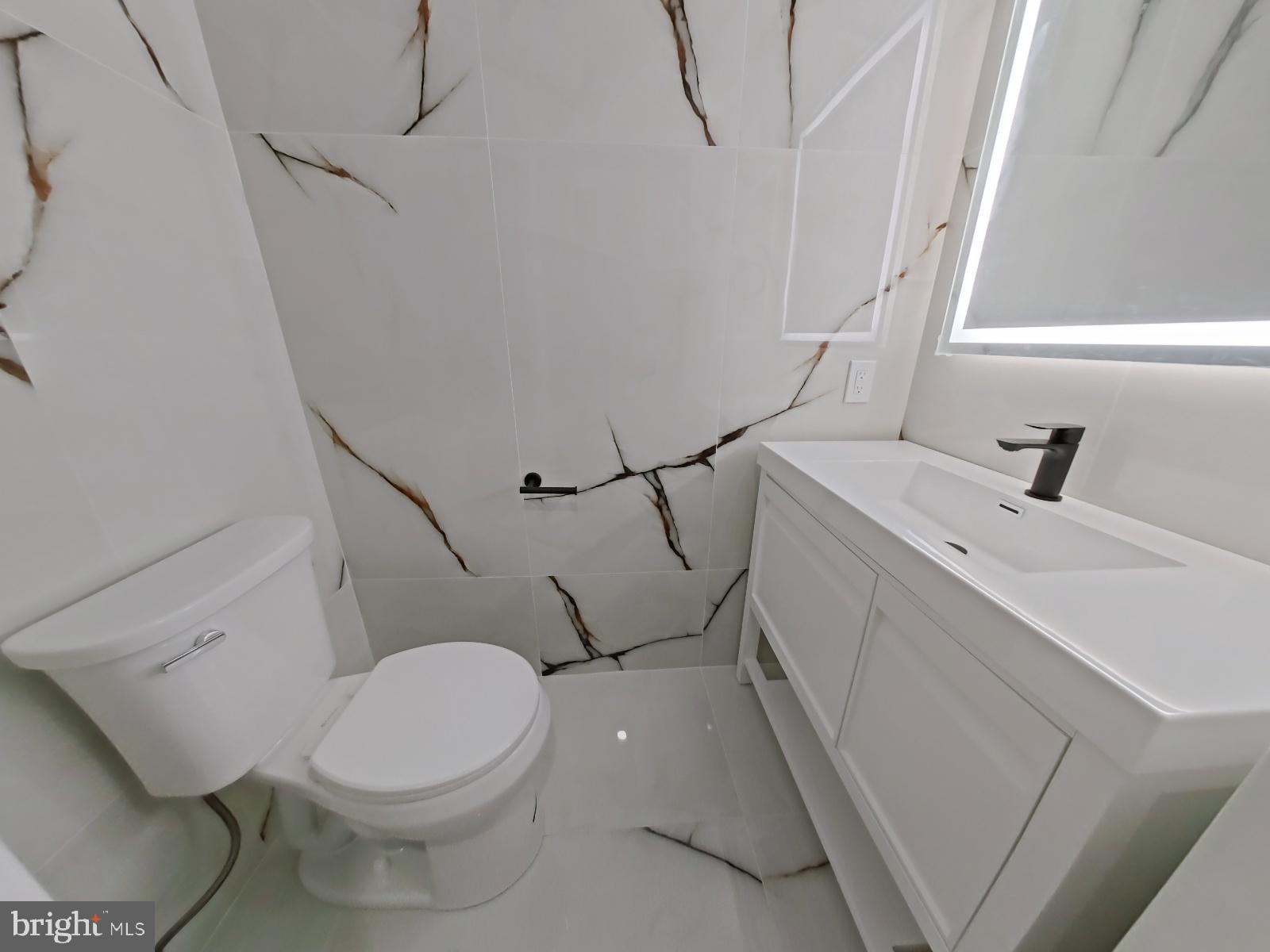 1307 North Randolph Street Philadelphia, PA 19122 - Photo 26 of 43 a bathroom with a sink a toilet and a shower