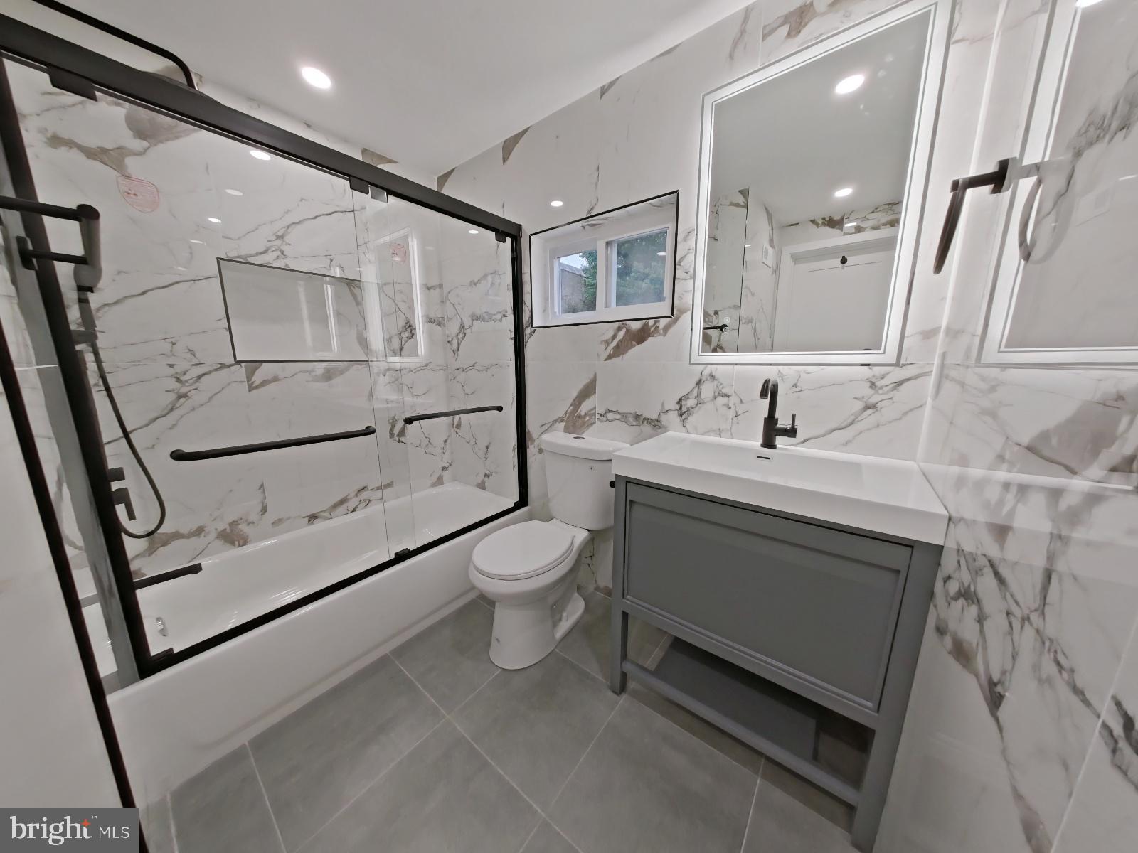 1307 North Randolph Street Philadelphia, PA 19122 - Photo 5 of 43 a bathroom with a sink a toilet and shower