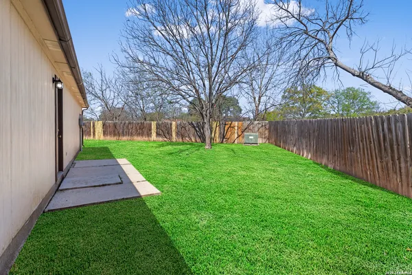 a view of backyard with green space