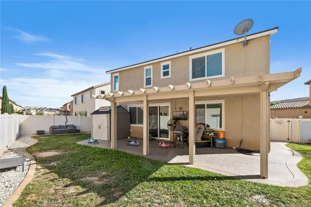 a view of a house with a yard porch and sitting area
