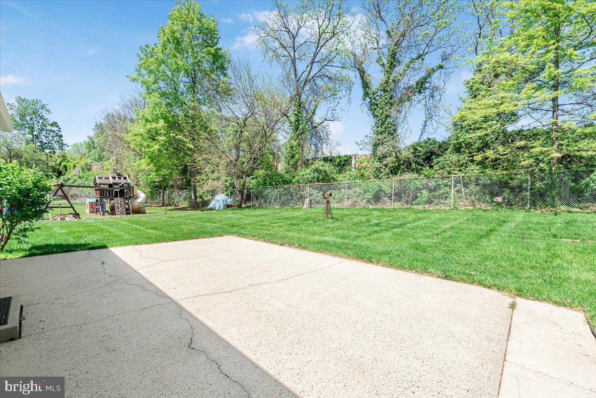 9619 Singleton Drive Bethesda, MD 20817 - Photo 18 of 25 a view of backyard with green space