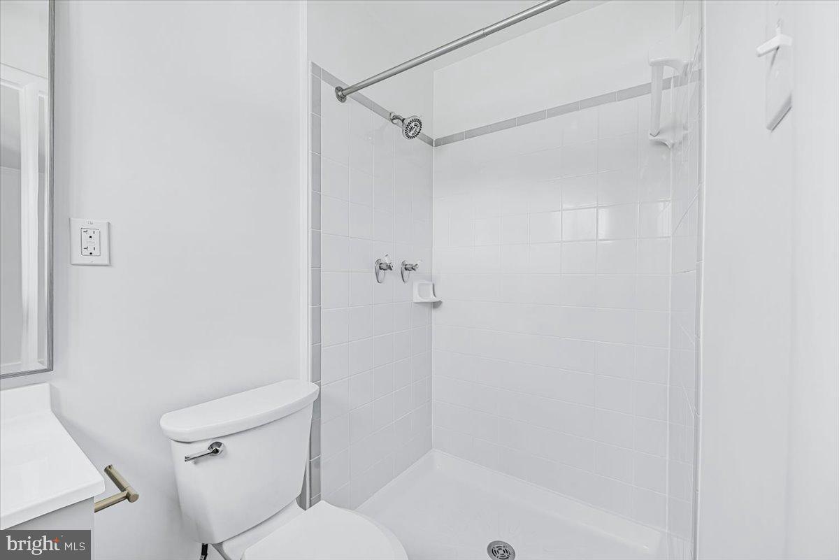 9619 Singleton Drive Bethesda, MD 20817 - Photo 7 of 25 a bathroom with a shower and a toilet