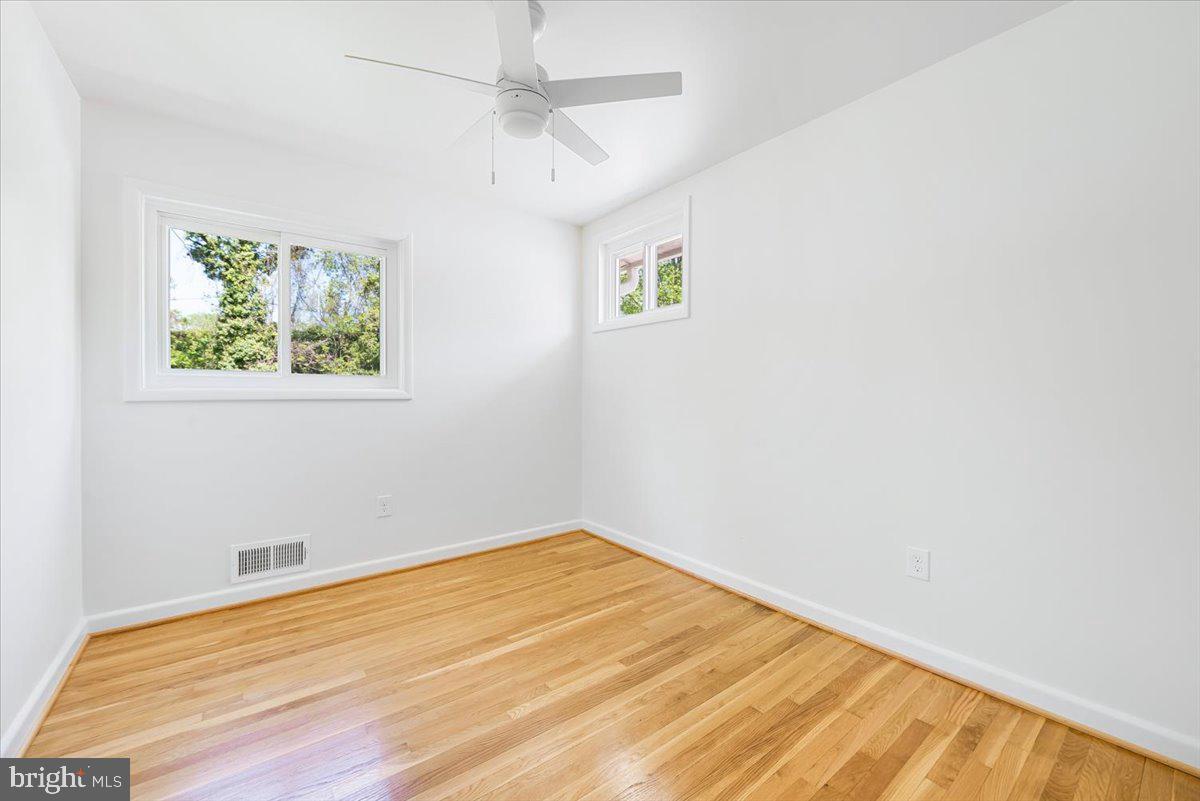 9619 Singleton Drive Bethesda, MD 20817 - Photo 8 of 25 a view of empty room with wooden floor