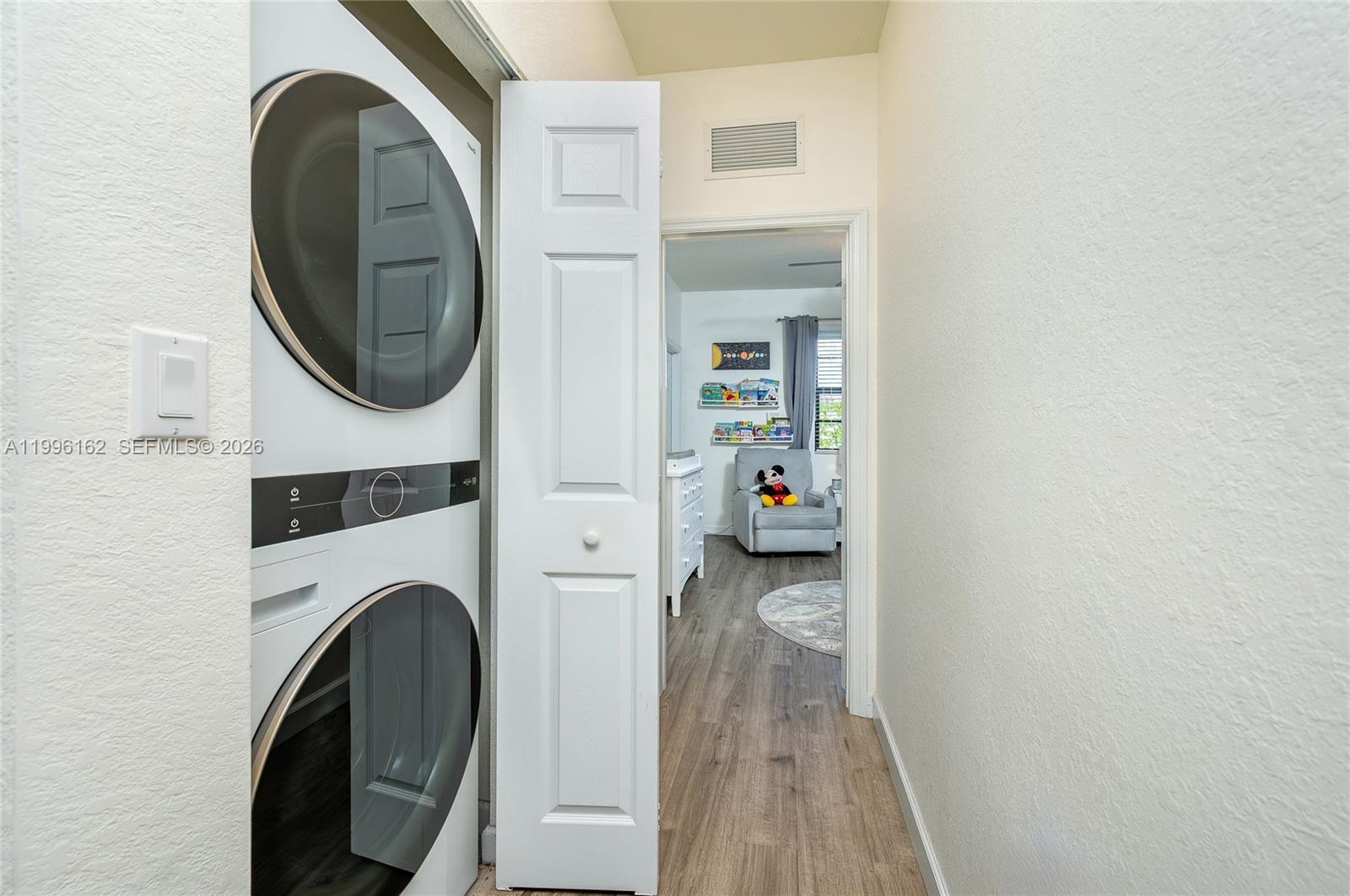 24951 Southwest 114th Court Homestead, FL 33032 - Photo 12 of 28 a view of livingroom with washer and dryer
