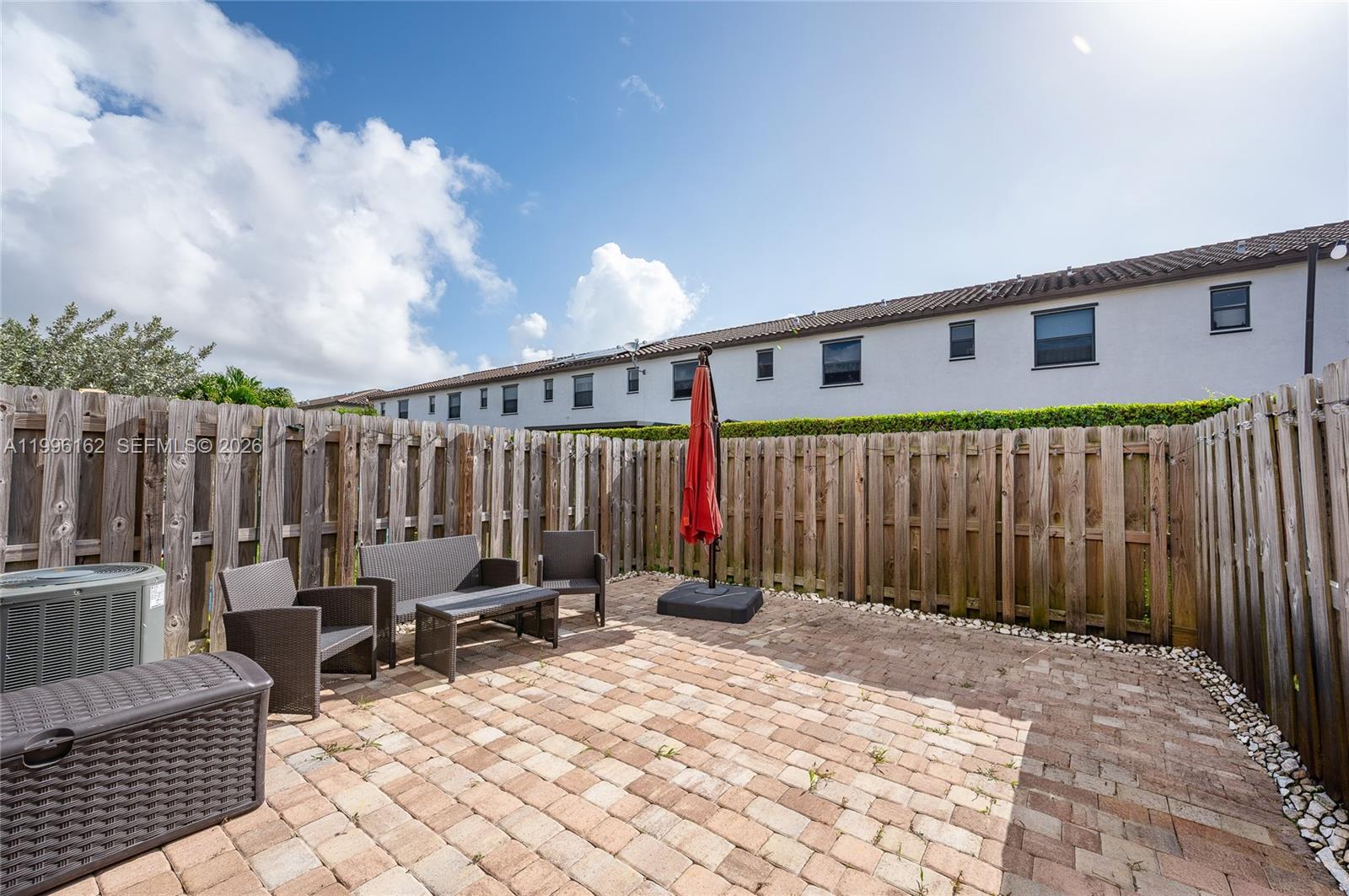 24951 Southwest 114th Court Homestead, FL 33032 - Photo 22 of 28 a view of a chair with wooden fence