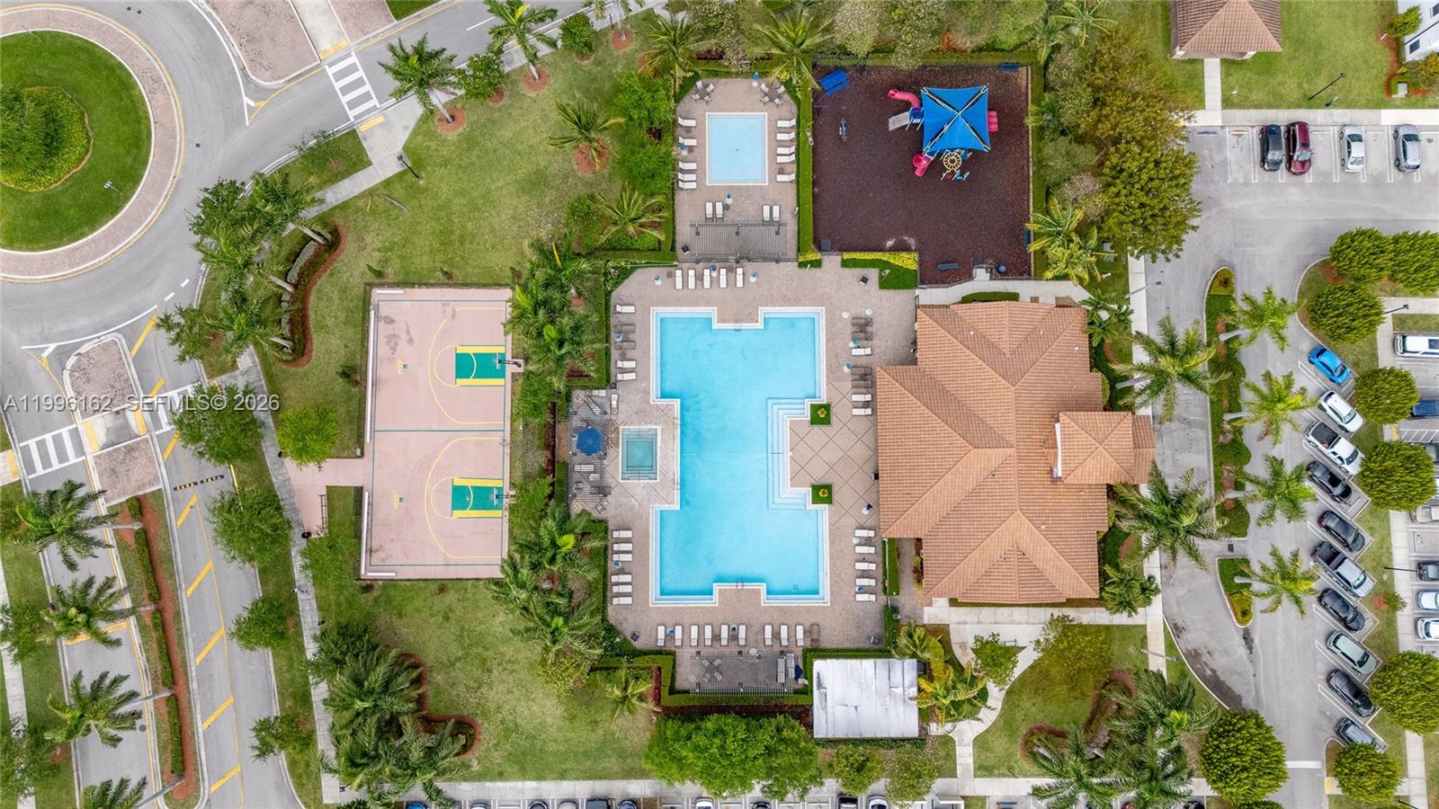24951 Southwest 114th Court Homestead, FL 33032 - Photo 24 of 28 an aerial view of a house with outdoor space and parking