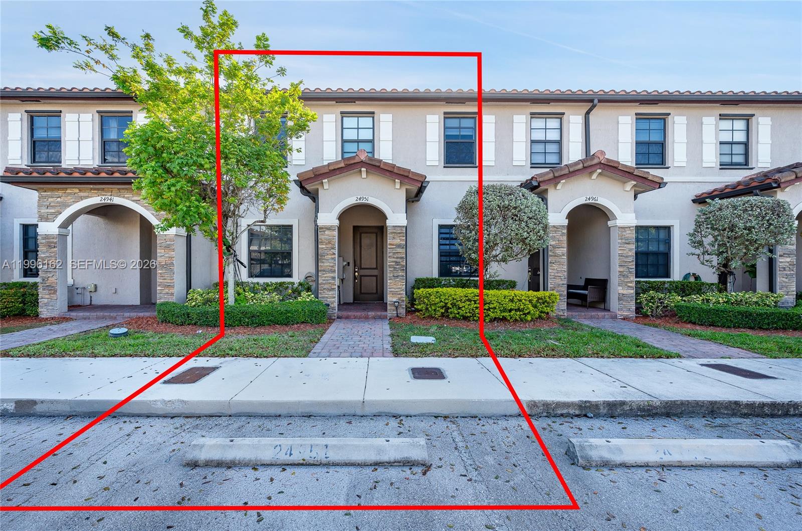 24951 Southwest 114th Court Homestead, FL 33032 - Photo 28 of 28 a front view of a house with yellow lighting