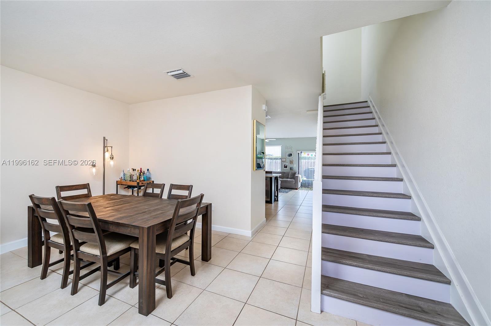 24951 Southwest 114th Court Homestead, FL 33032 - Photo 3 of 28 a view of a dining room with furniture