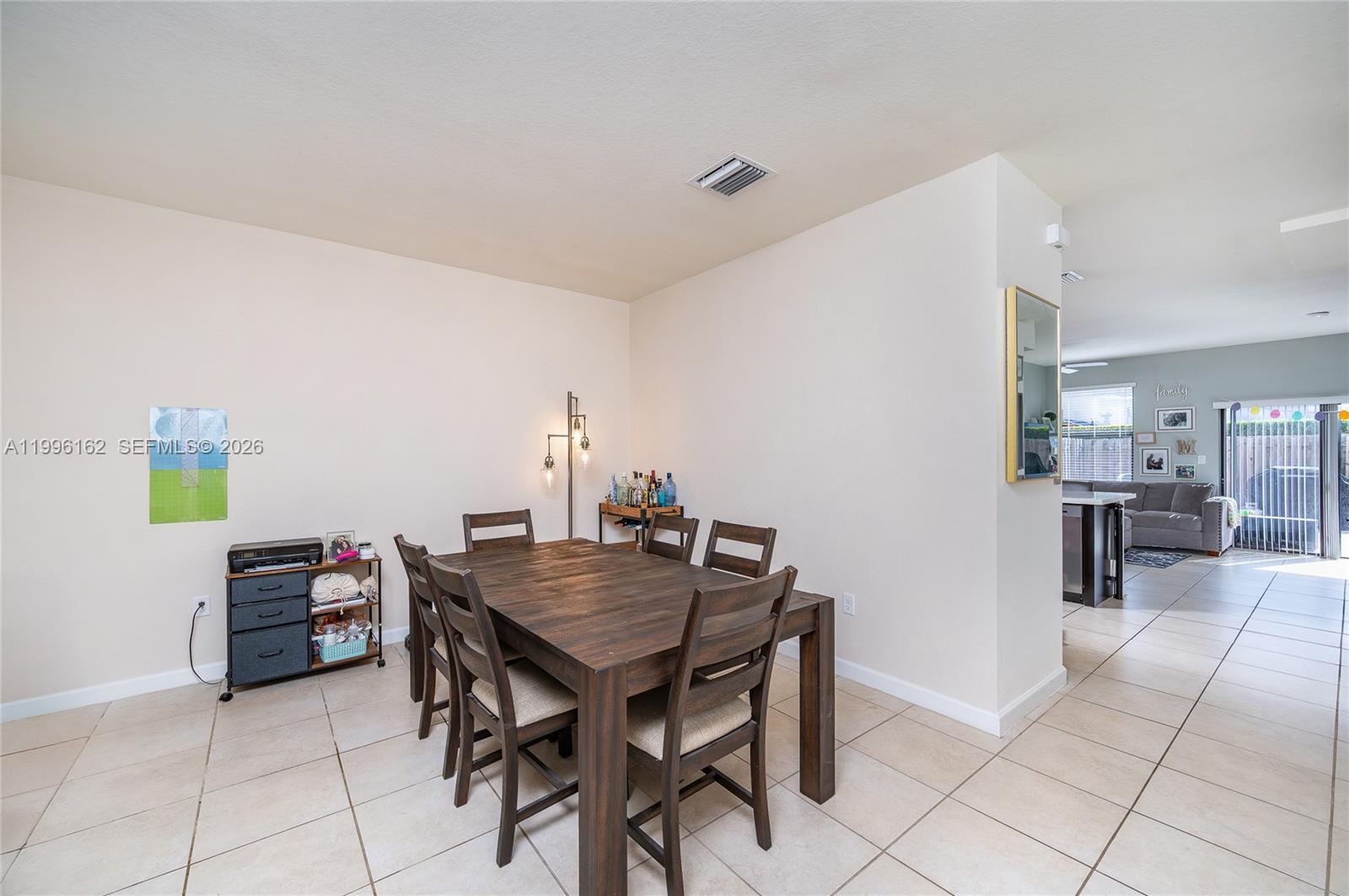 24951 Southwest 114th Court Homestead, FL 33032 - Photo 4 of 28 a view of a dining room with furniture