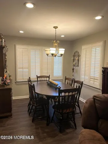 a view of a dining room with furniture and window