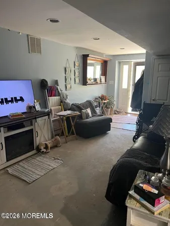 a view of a livingroom with furniture and windows