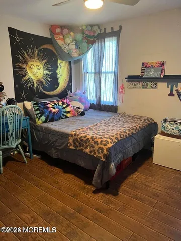 a bedroom with bed and window