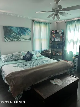 a bedroom with a bed and window