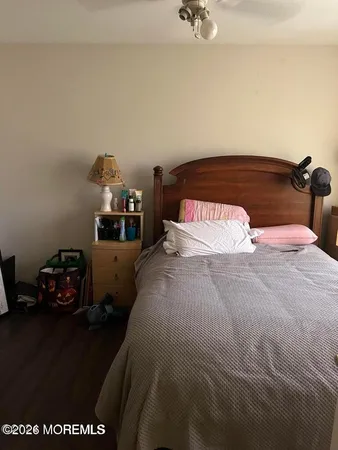 a bedroom with a bed and a dresser