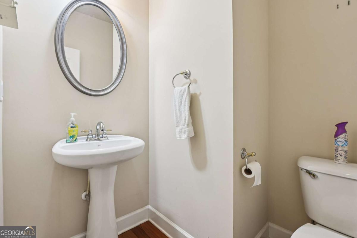 3180 The Commons Drive Cumming, GA 30041 - Photo 24 of 84 a bathroom with a sink and a mirror