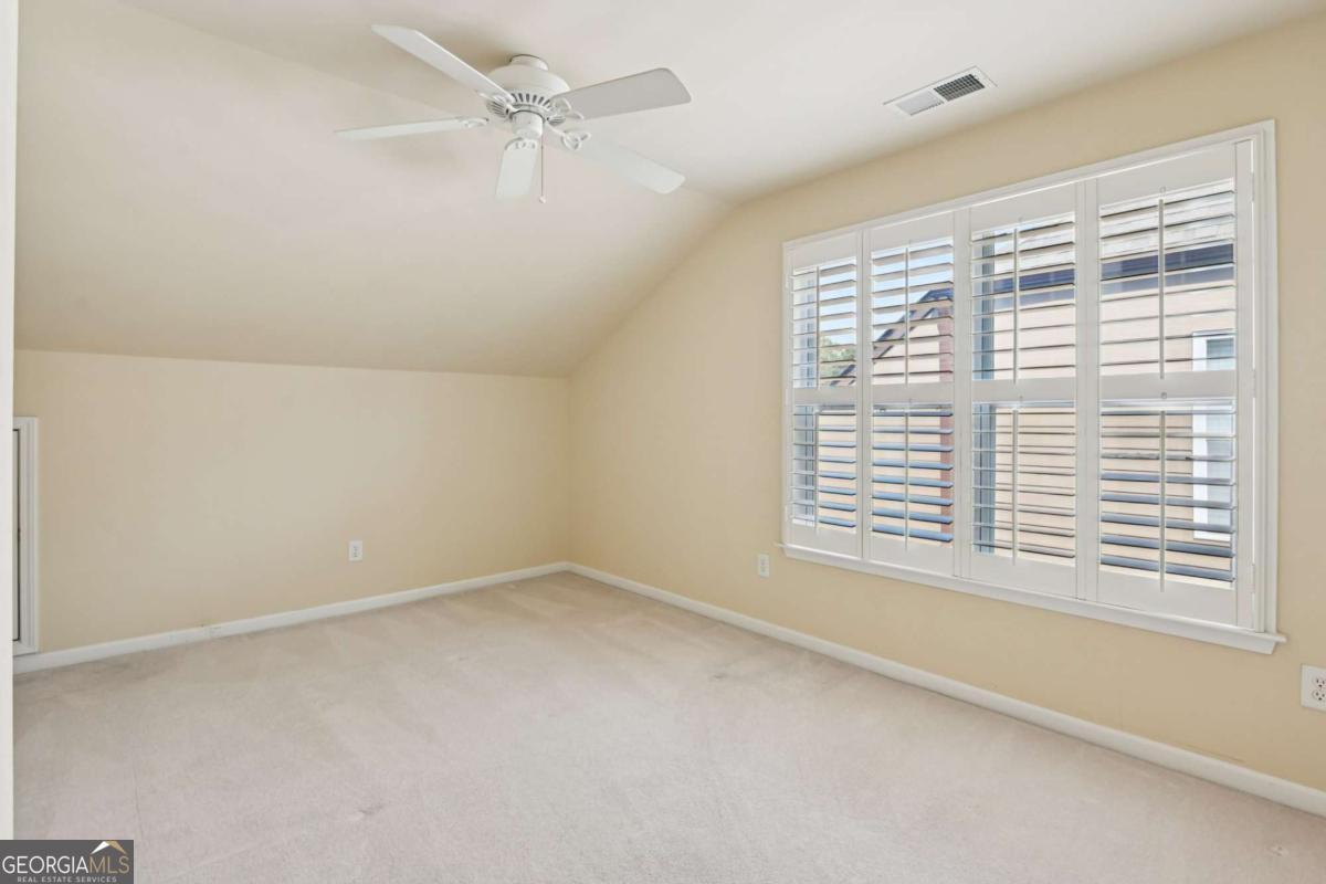 3180 The Commons Drive Cumming, GA 30041 - Photo 39 of 84 a view of an empty room with a window