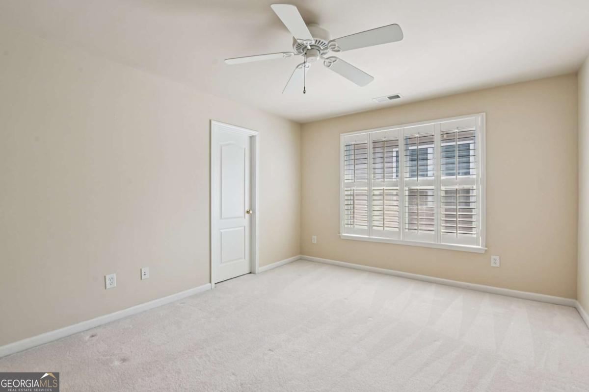 3180 The Commons Drive Cumming, GA 30041 - Photo 52 of 84 a view of an empty room with a window