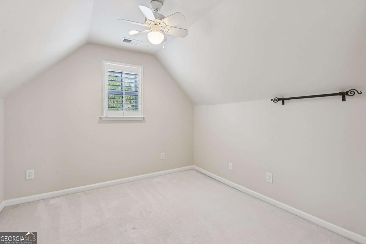 3180 The Commons Drive Cumming, GA 30041 - Photo 62 of 84 an empty room with a window and a fan