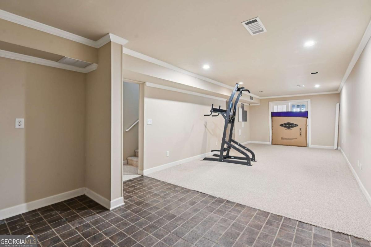 3180 The Commons Drive Cumming, GA 30041 - Photo 64 of 84 a view of a room with gym equipment