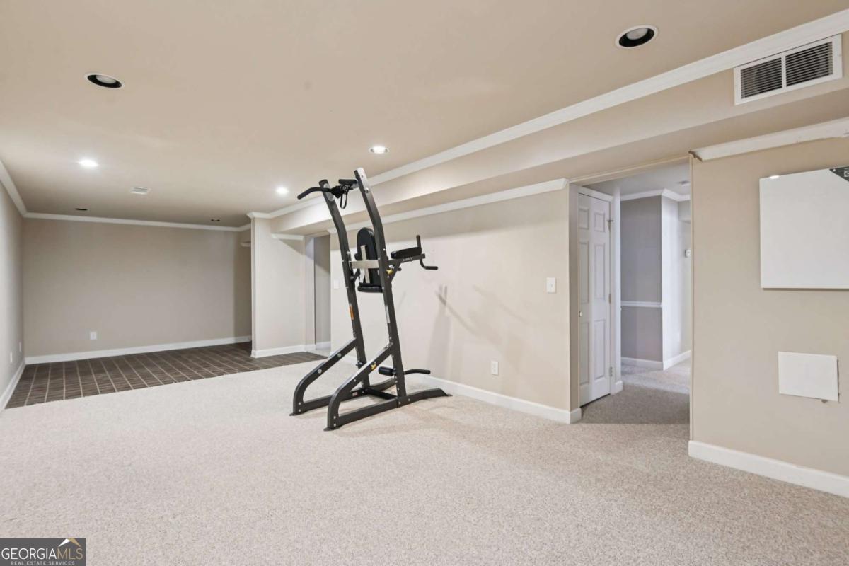 3180 The Commons Drive Cumming, GA 30041 - Photo 65 of 84 a view of a room with gym equipment