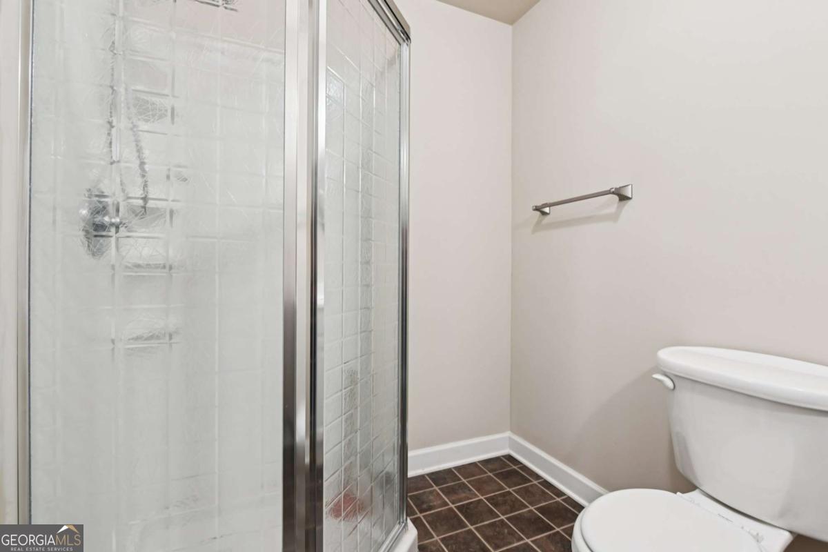 3180 The Commons Drive Cumming, GA 30041 - Photo 68 of 84 a white toilet sitting next to a shower