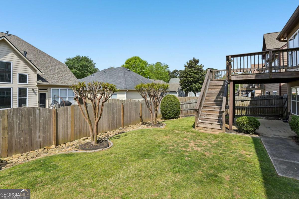 3180 The Commons Drive Cumming, GA 30041 - Photo 81 of 84 a view of a backyard with a garden