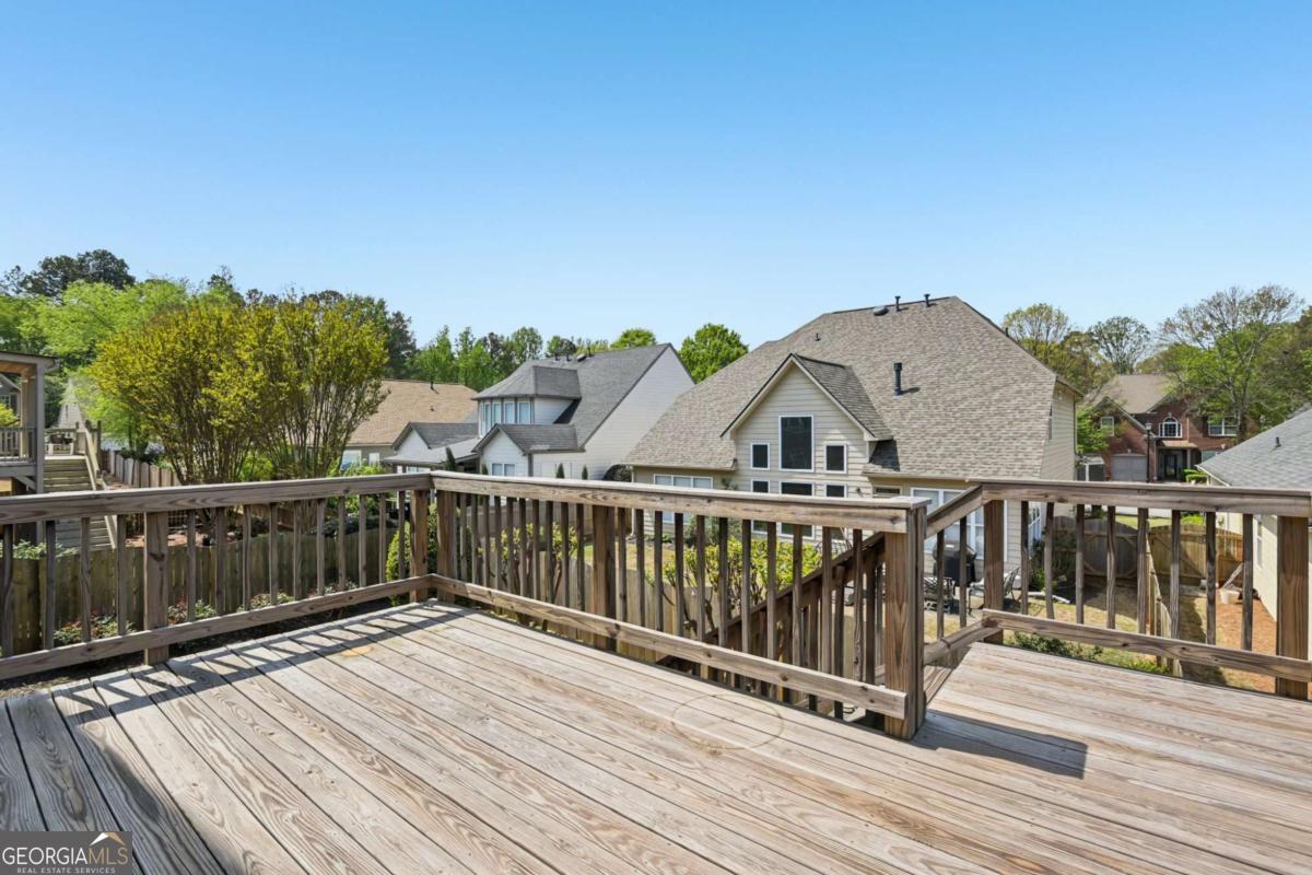 3180 The Commons Drive Cumming, GA 30041 - Photo 82 of 84 a view of a wooden roof deck