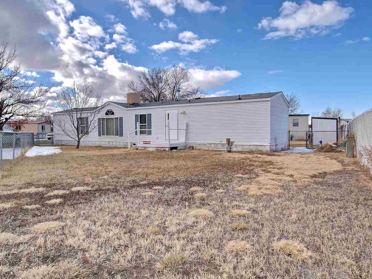 424 32 Road, Unit 72 Clifton, CO 81520 - Photo 27 of 30 a view of a house with a yard