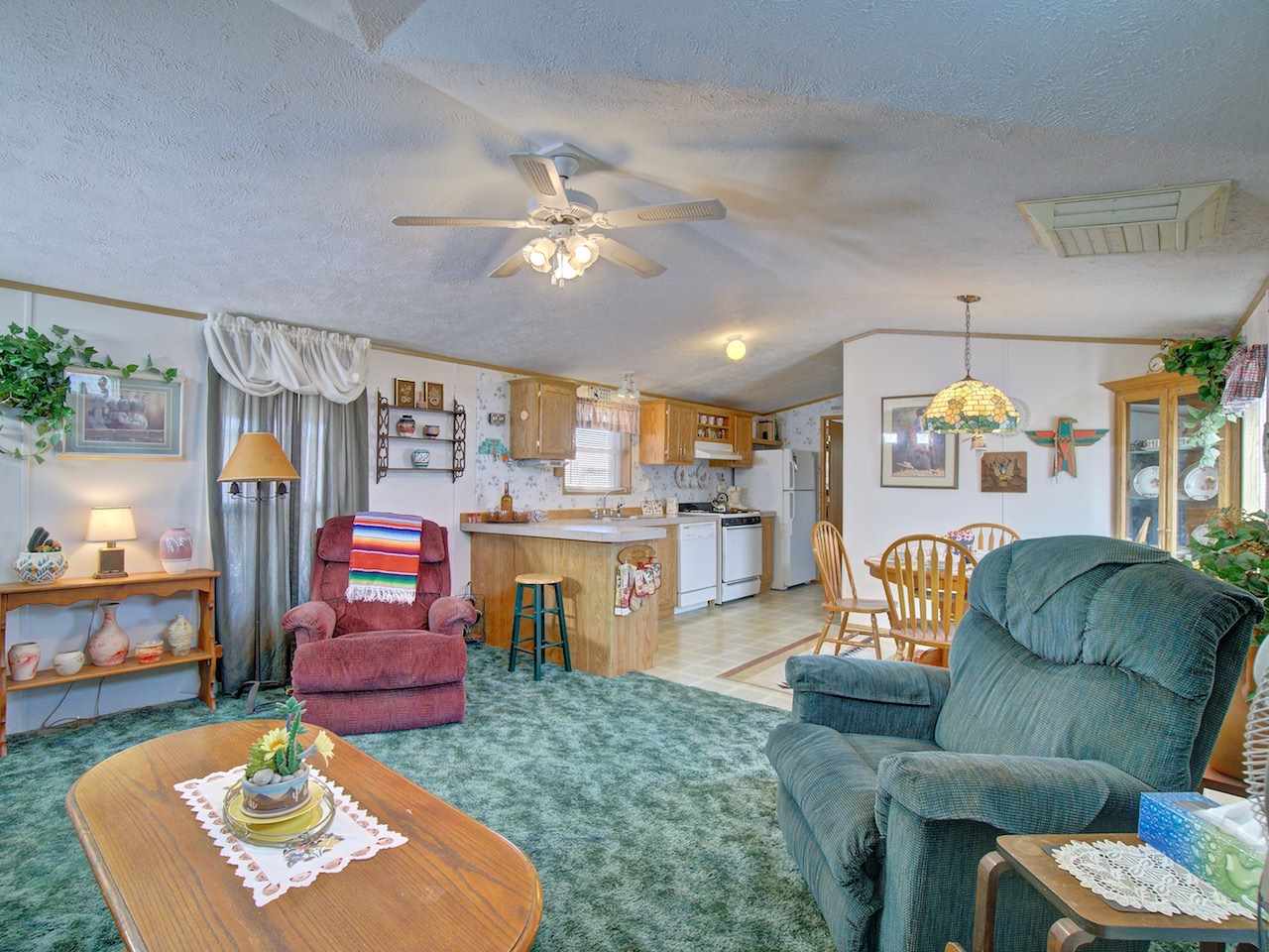 424 32 Road, Unit 72 Clifton, CO 81520 - Photo 4 of 30 a living room with furniture and kitchen view