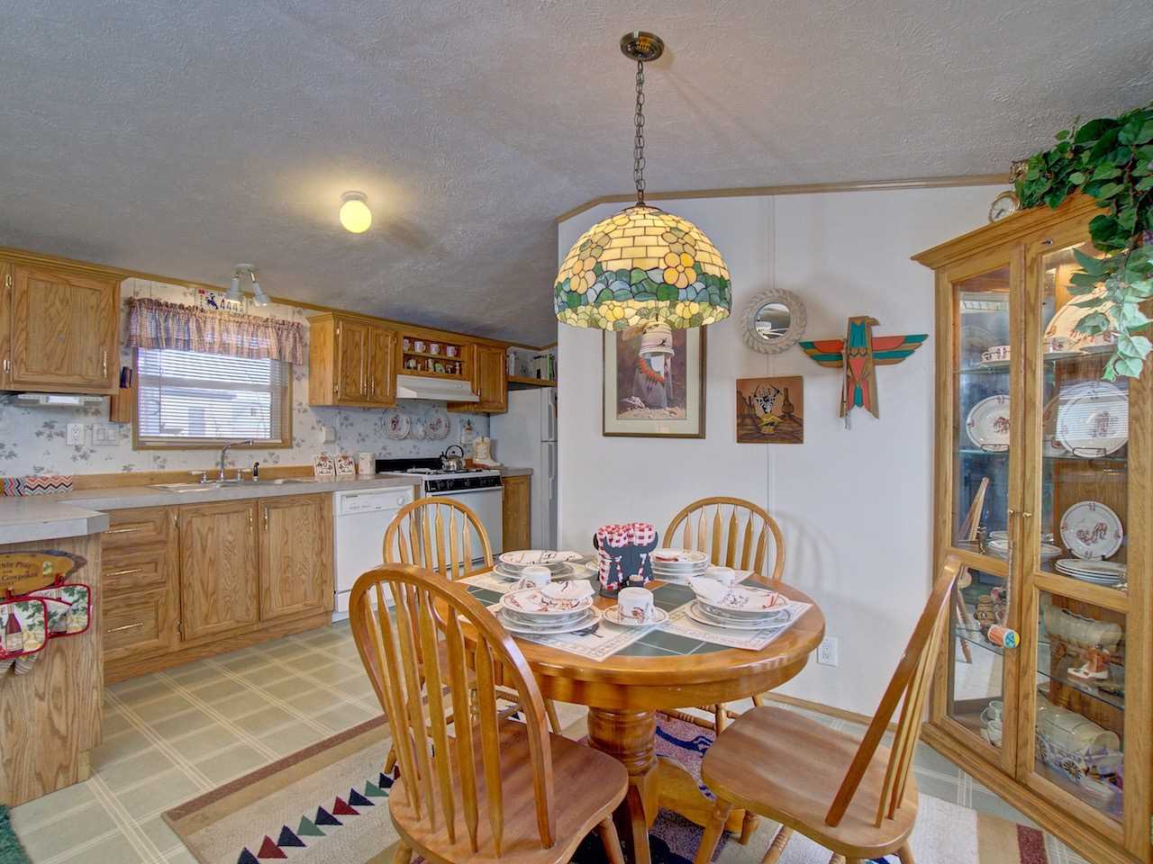 424 32 Road, Unit 72 Clifton, CO 81520 - Photo 6 of 30 a dining room with furniture and chandelier