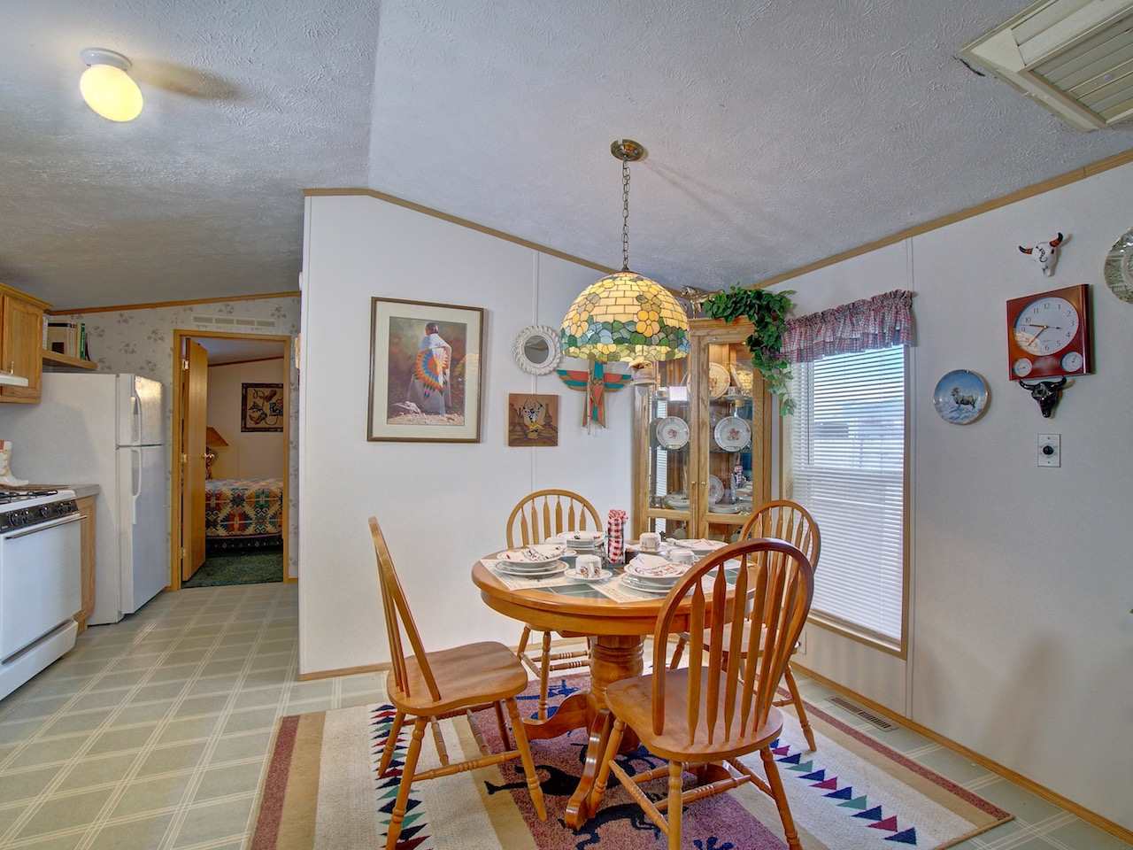 424 32 Road, Unit 72 Clifton, CO 81520 - Photo 8 of 30 a view of a dining room with furniture and chandelier