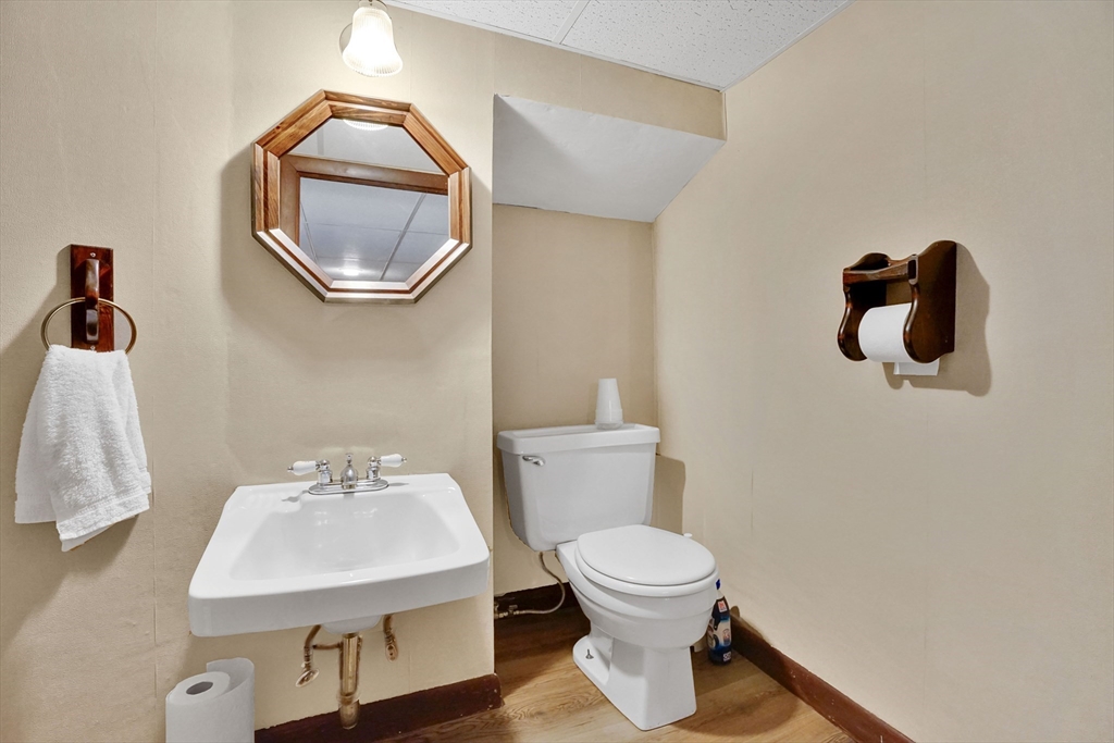 1133 Burnett Road Chicopee, MA 01020 - Photo 32 of 40 a bathroom with a sink toilet and mirror