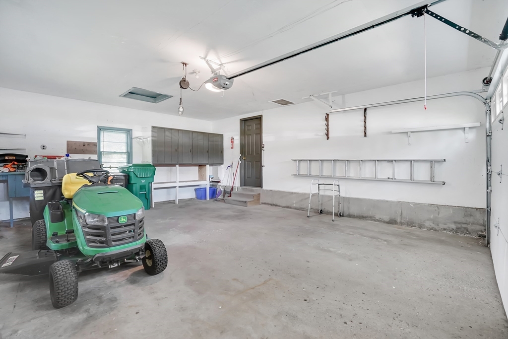 1133 Burnett Road Chicopee, MA 01020 - Photo 36 of 40 a room with pool table gym equipment and windows