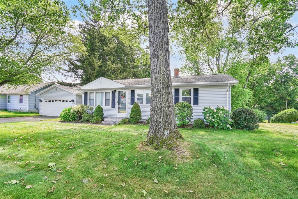 1133 Burnett Road Chicopee, MA 01020 - Photo 37 of 40 a front view of a house with a yard
