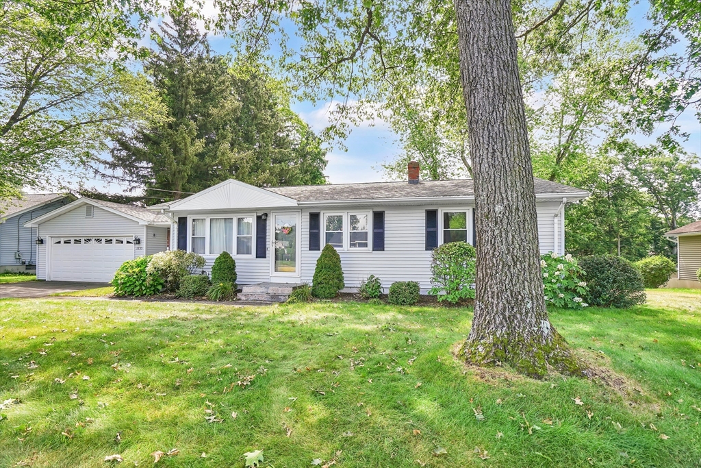 1133 Burnett Road Chicopee, MA 01020 - Photo 38 of 40 a front view of a house with garden