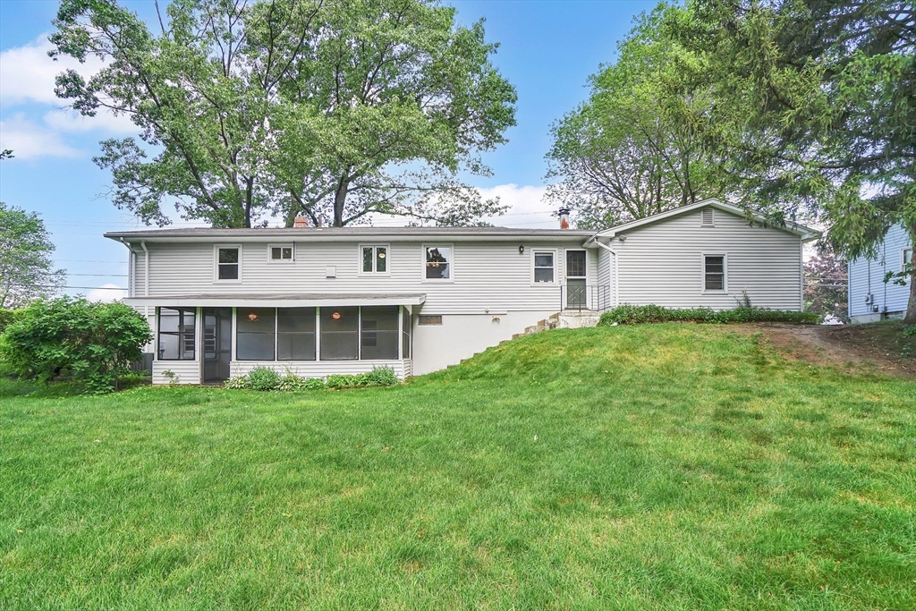 1133 Burnett Road Chicopee, MA 01020 - Photo 39 of 40 a view of a house with yard and sitting area