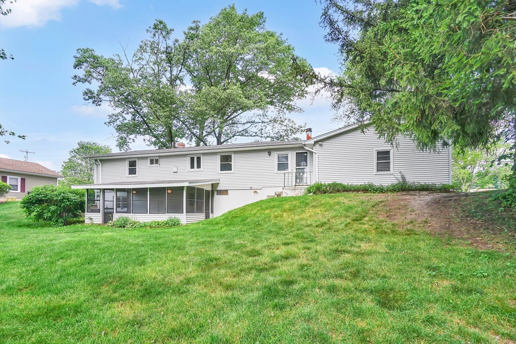 1133 Burnett Road Chicopee, MA 01020 - Photo 40 of 40 a house view with a garden space