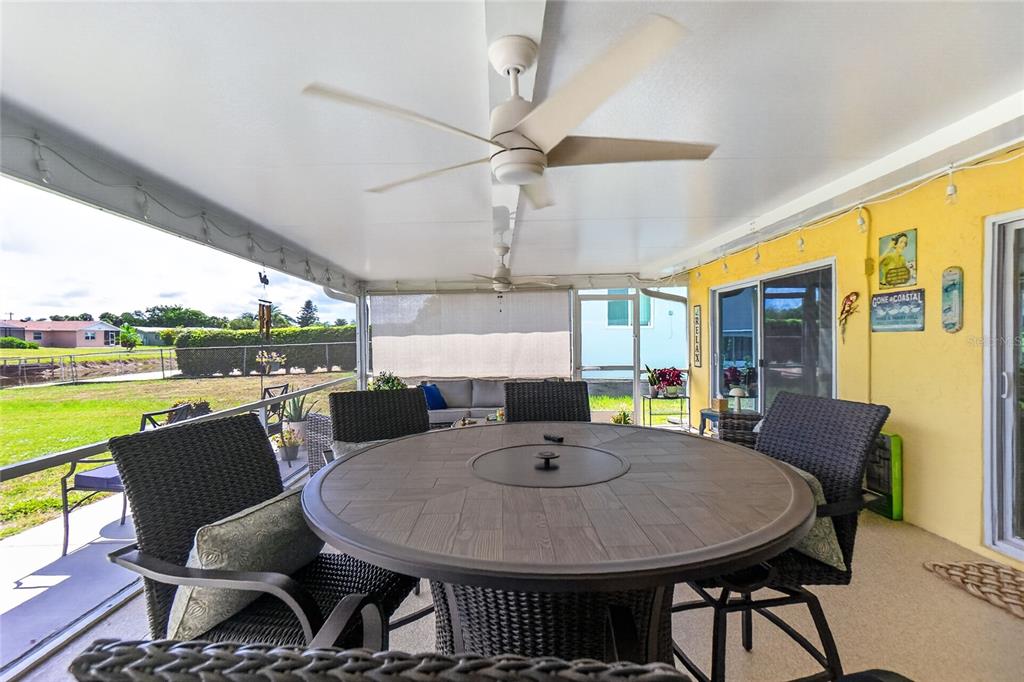 219 Caddy Road Rotonda West, FL 33947 - Photo 49 of 89 a view of a dining room with furniture window and outside view