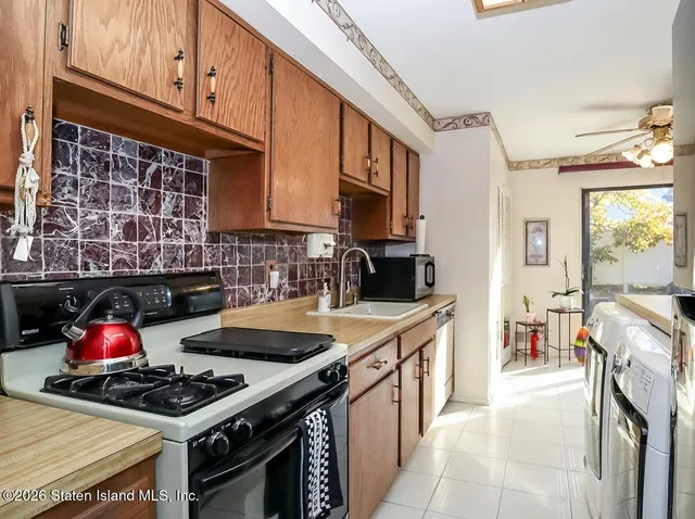 a kitchen with a stove and a refrigerator