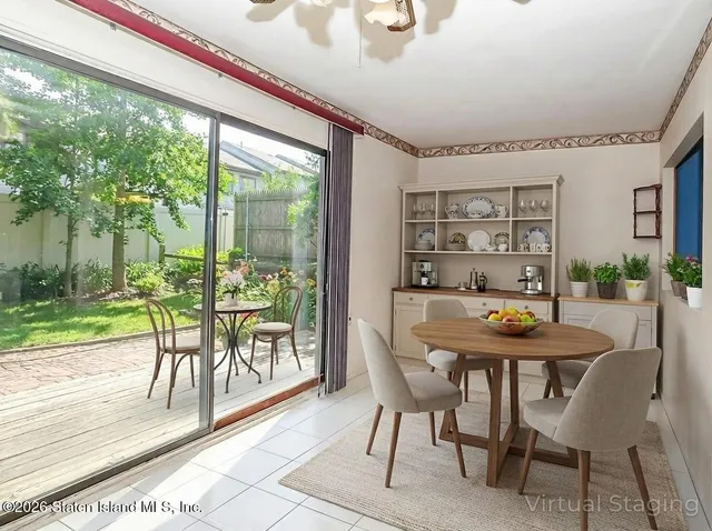 a view of a dining room with furniture window and outside view